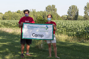 Summer Camp Staff holding a CLYS Camp Banner
